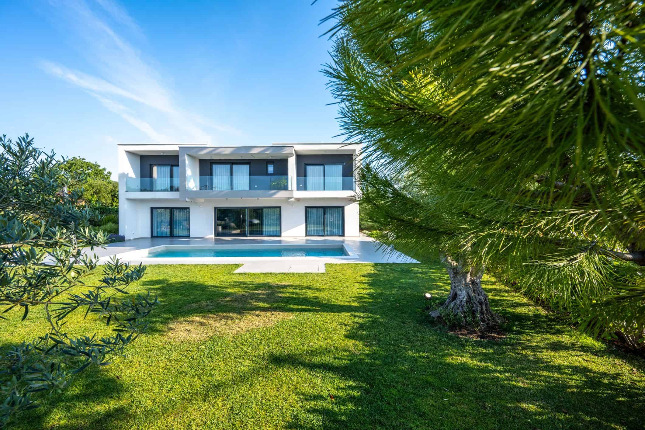 Luxury modern custom home exterior with pool
