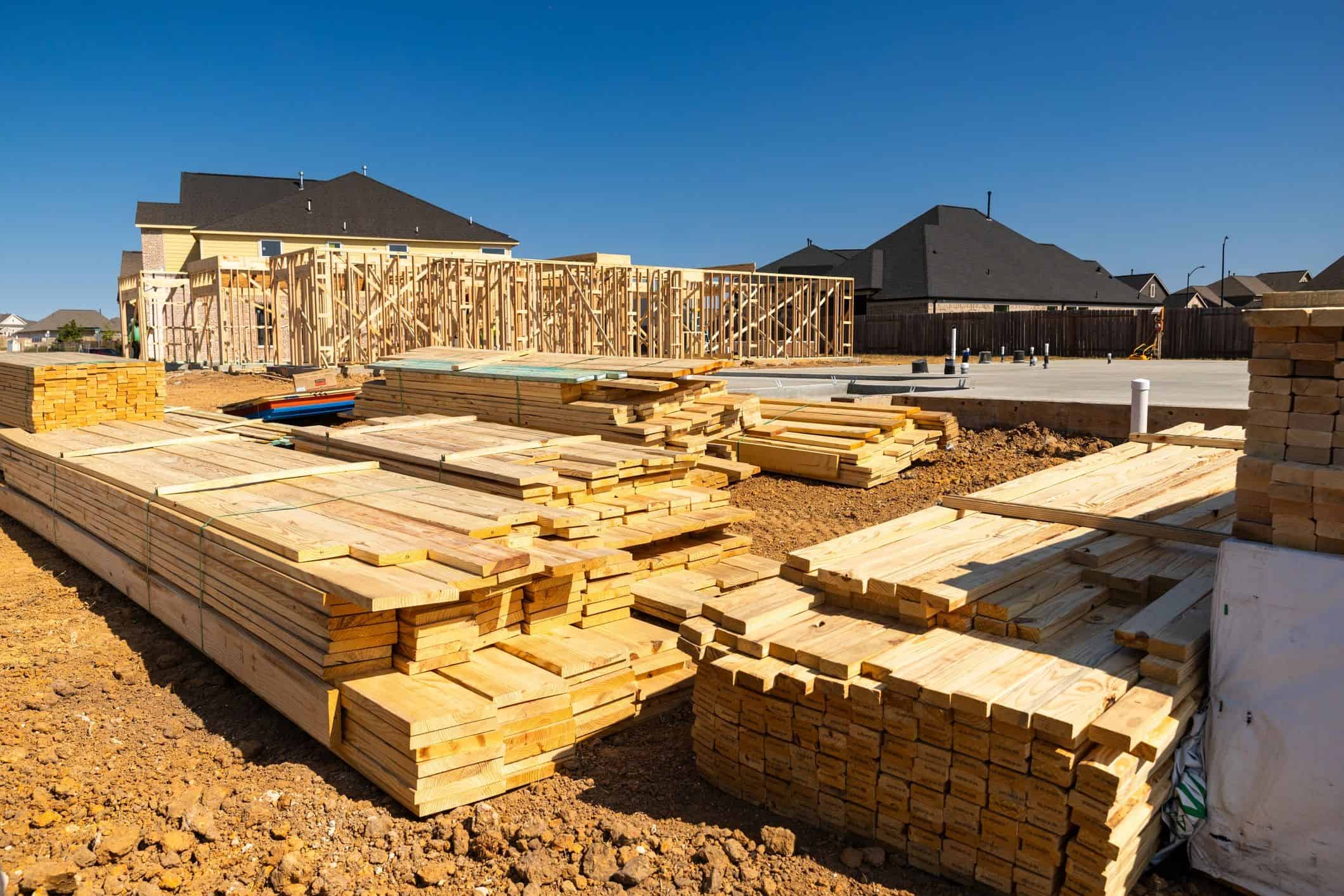 Framing timber beside a new residential foundation