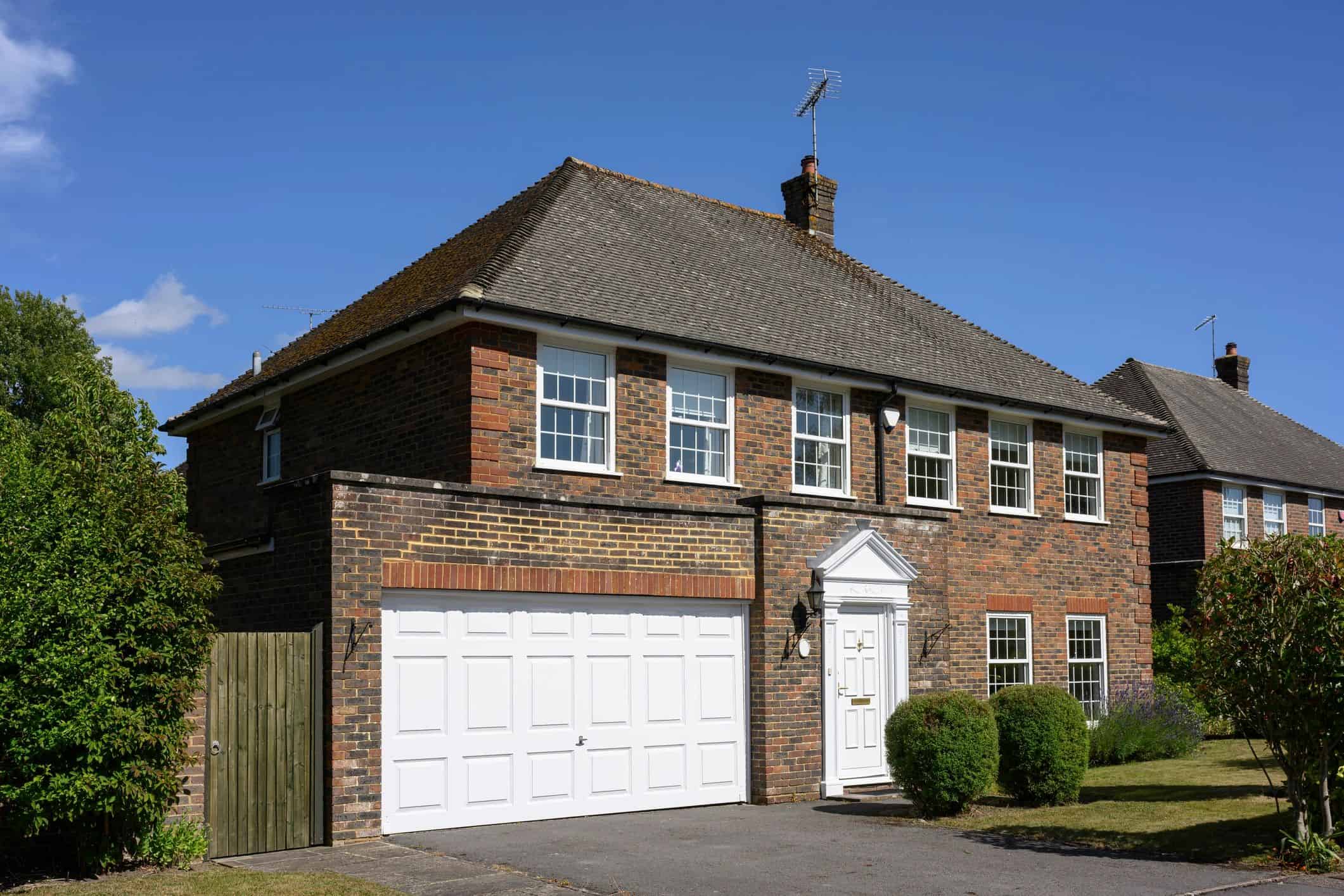Brick home with garage and driveway
